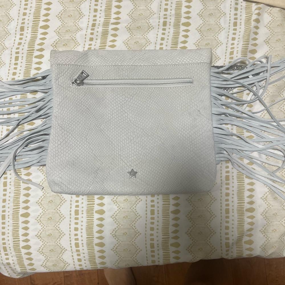 Silver bag, it’s clean the color looks off on camera